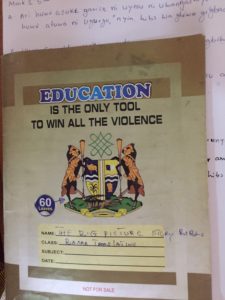 School exercise book with the slogan: Education is the only tool to win all the violence